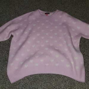 A purple sweater with white hearts